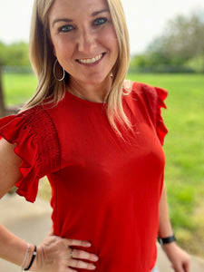 Red smocked ruffle sleeve top