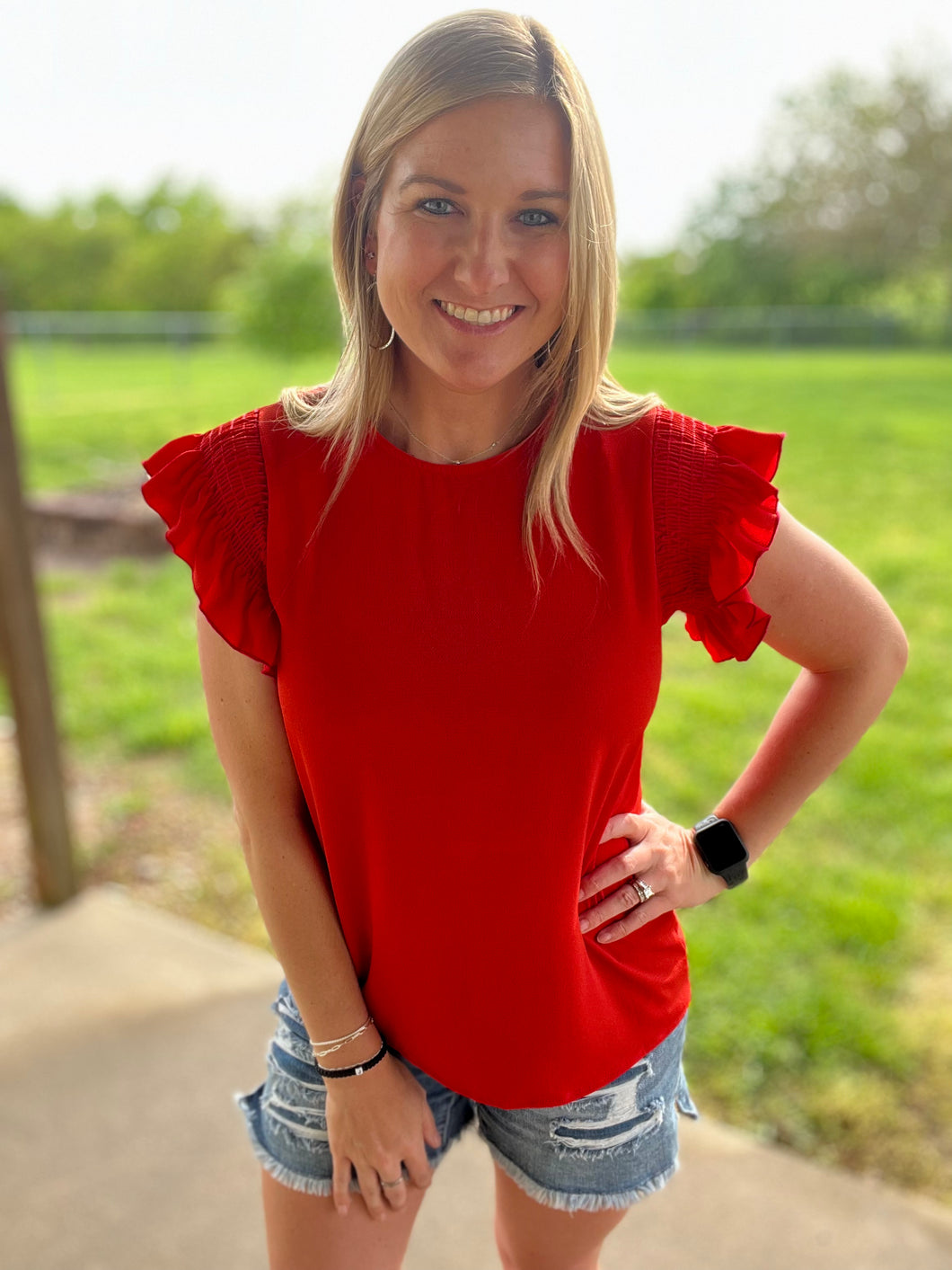 Red smocked ruffle sleeve top