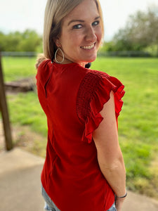 Red smocked ruffle sleeve top